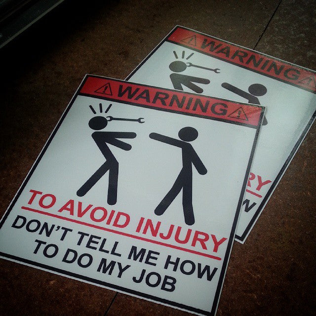 "WARNING don't tell me how to do my job" sticker.